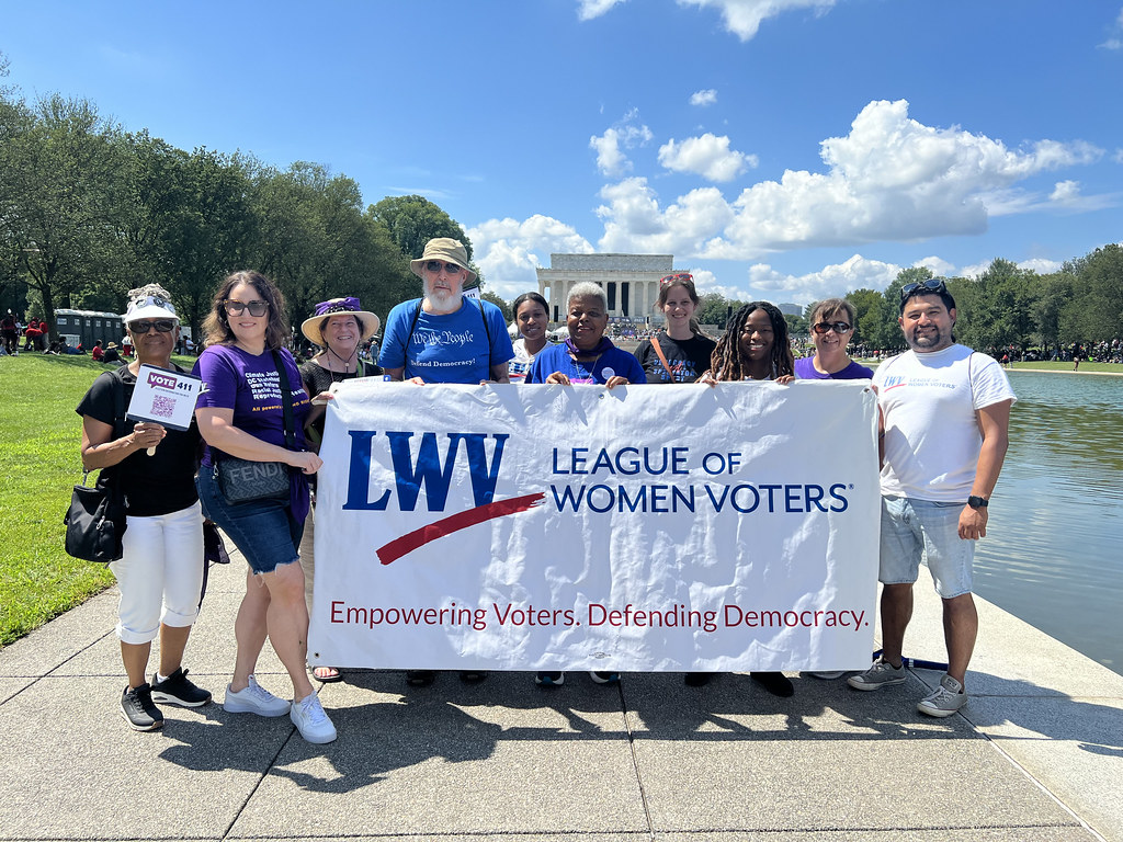 LWV members at the National Mall holding a LWV banner
