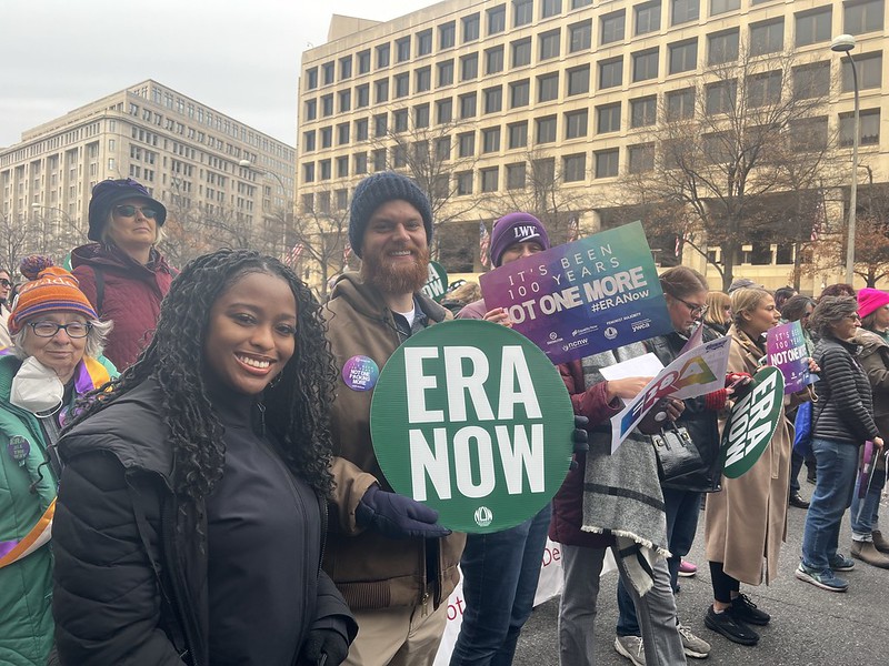 LWV Members holding a sign that says 